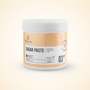 A white plastic jar of Radeq Lab Sugar Paste, featuring a light peach and white label with black text, set against a solid cream background.